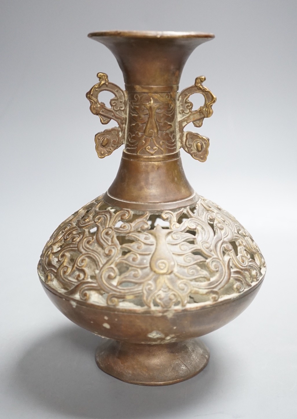 A Chinese pierced brass vase - 20cm tall